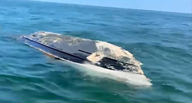 capsized boat off Massachusetts Beach