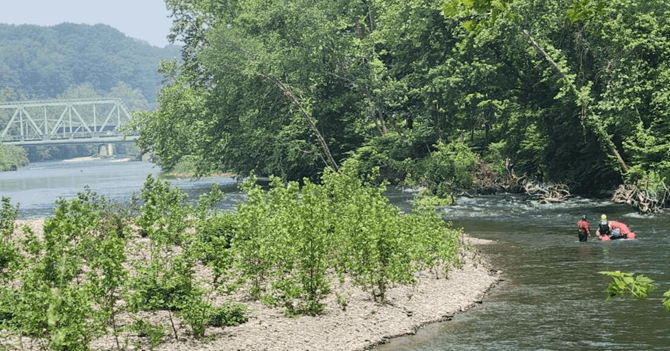 Emergency crews searching for a kayaker who tipped over in rapids after heavy rain