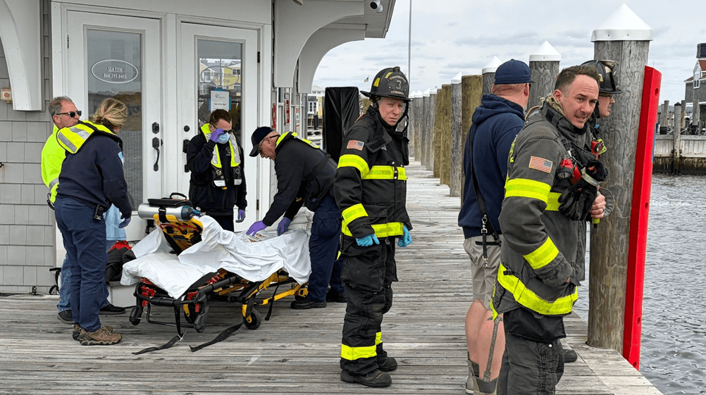 A group of firefighters on a bridge