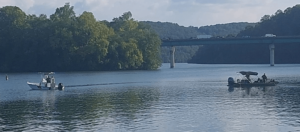 Two boats searching on a lake