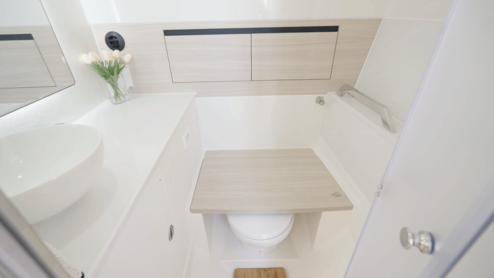 electric toilet with fold down seat