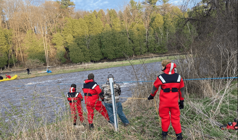 Kayakers getting rescued