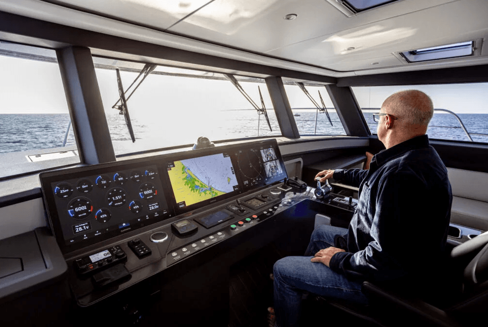 man operating boat with modern digital equipemnt 