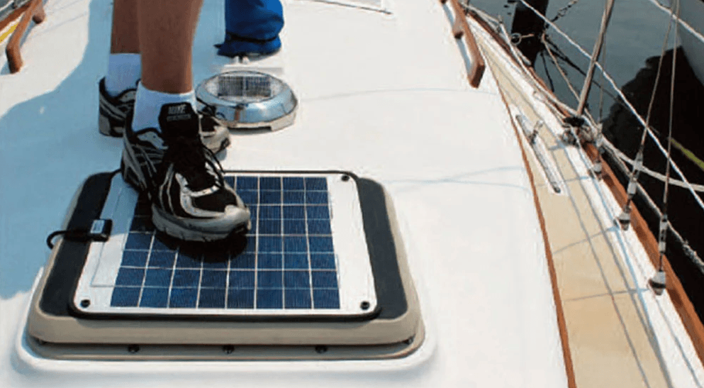man stepping on a solar panel