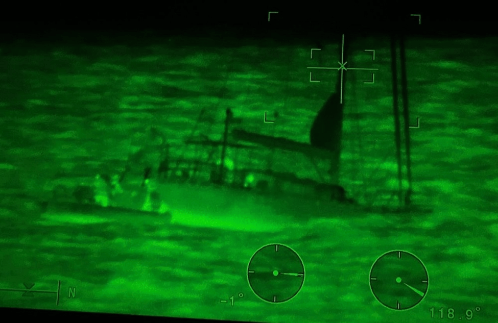 Night vision showing a sailboat