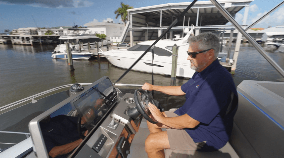 Captain Gregg taking the 480 Fly out of her slip at MarineMax in Naples, FL