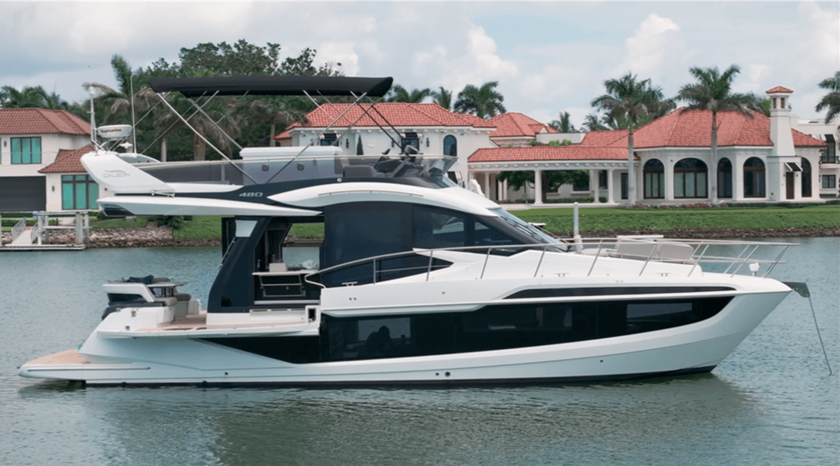 The 480 Fly at anchor with her balconies down in Naples, FL