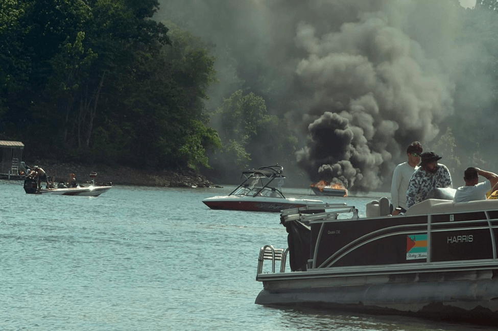 A boat on fire in a lake