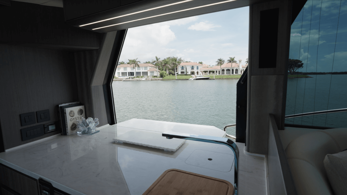 Port window above galley open with leaf folded up