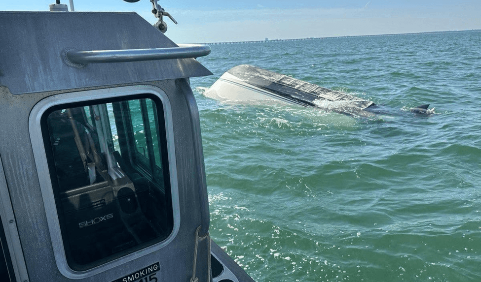 A boat flipped over in water