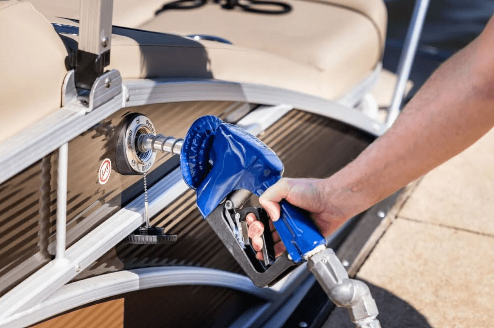person putting fuel in their boat