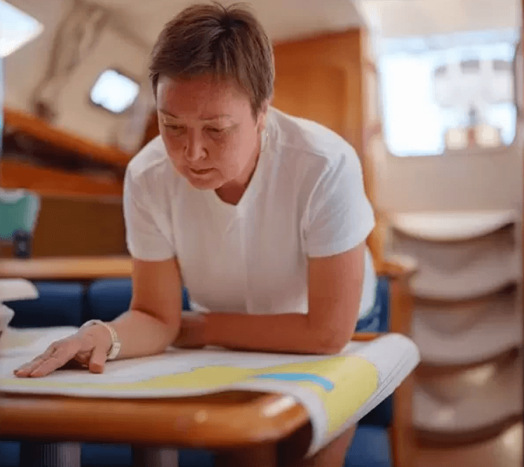 woman looking at a paper chart