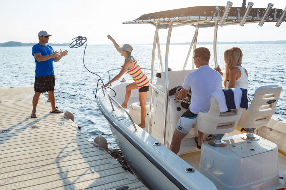 people on a boat at a dock