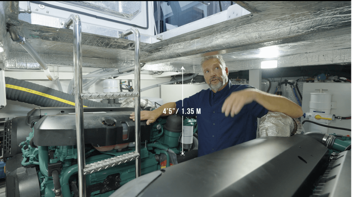 There is 4’ 5” of headroom in between the main engines. 2” less under the stringers