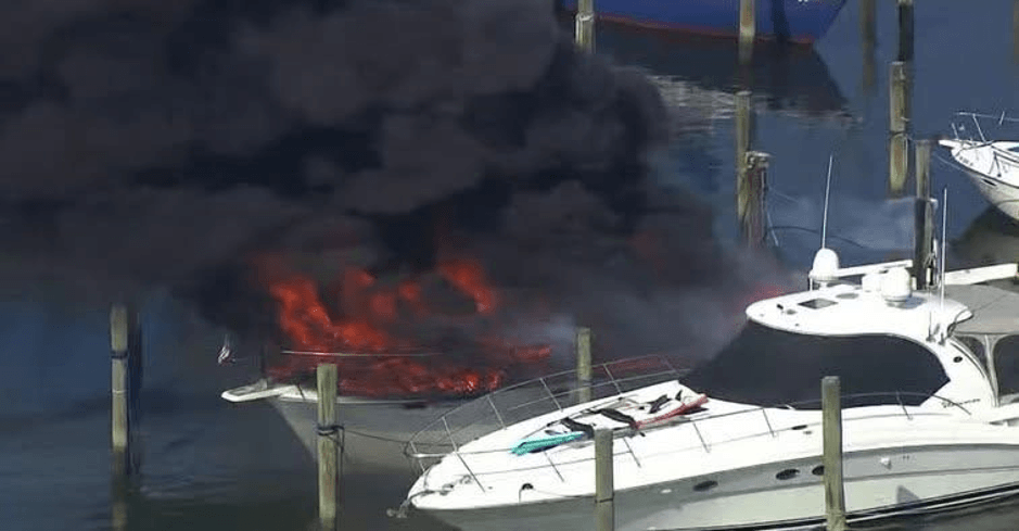 Boat on fire at a dock