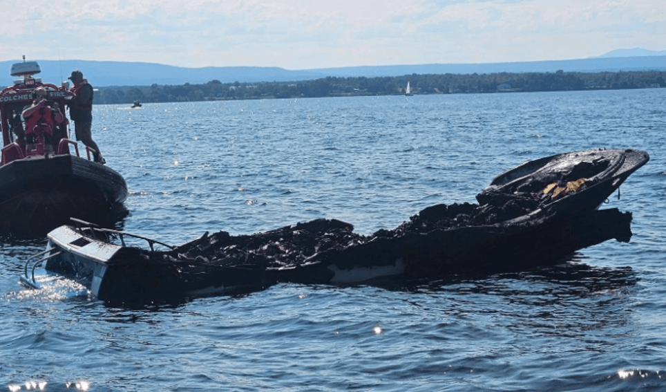 Burned boat on a lake