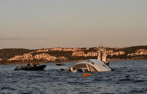 The yacht on its side with hull exposed