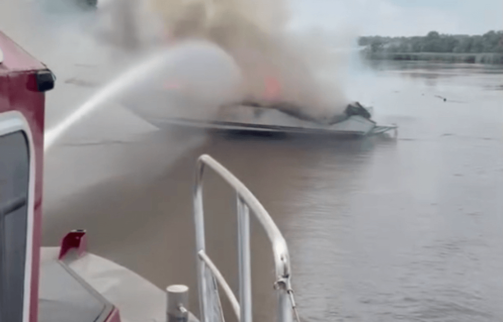 A boat on fire in a canal