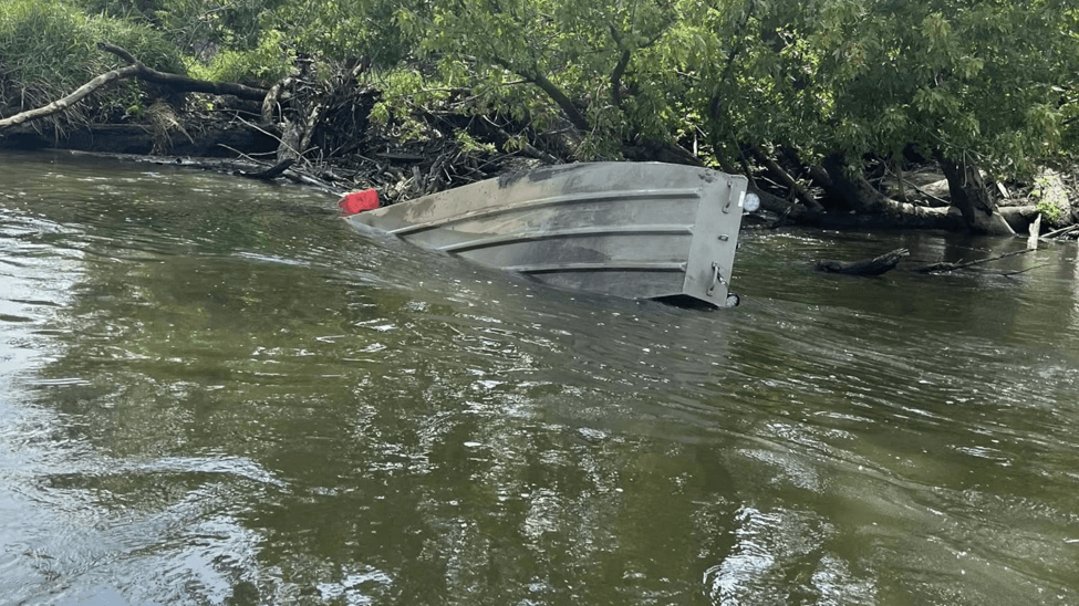 Boater stuck in a log