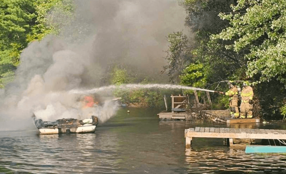 Boat on fire in a lake