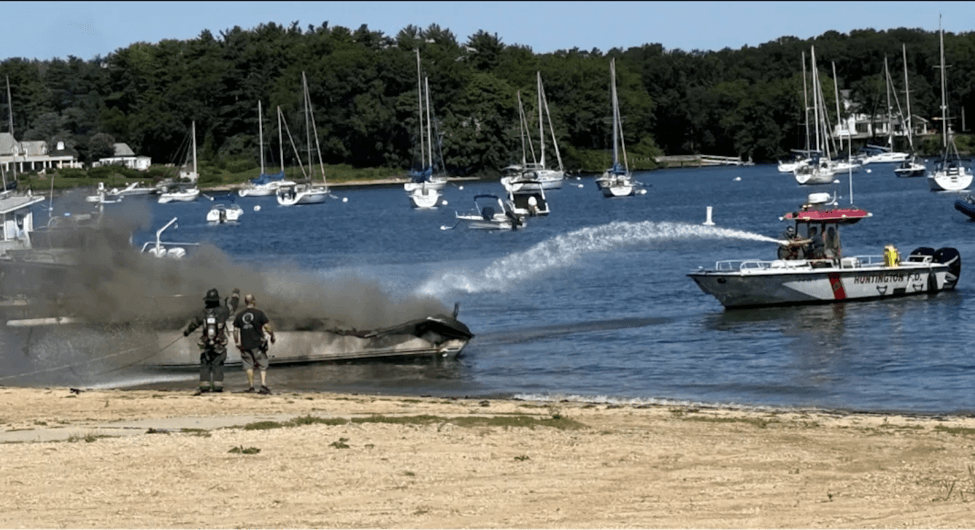 Firefighters put out a boat on fire