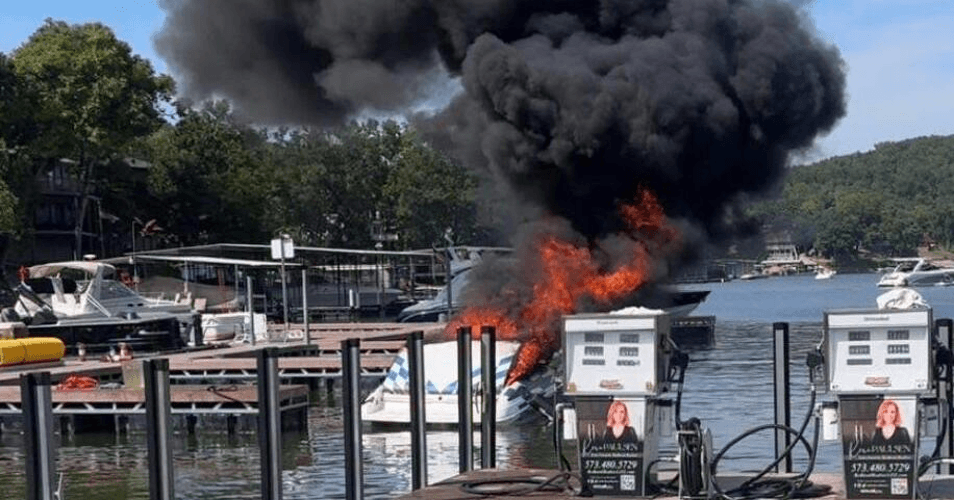 Boat on fire at a dock