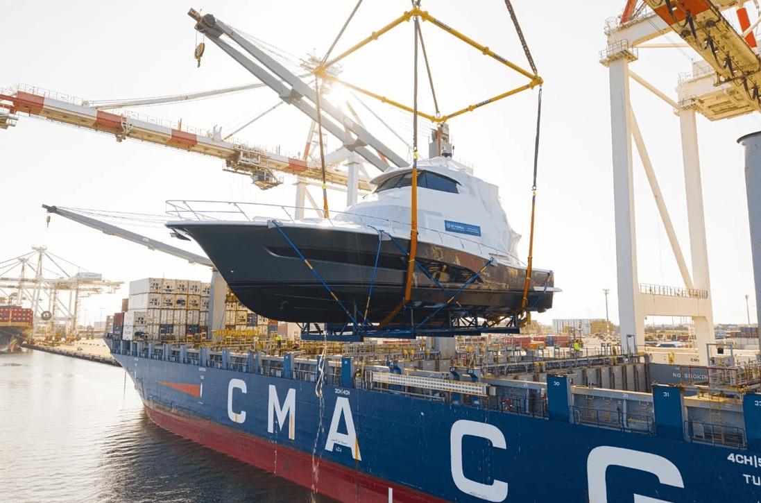 Riviera Yacht being lifted from the water to be transported