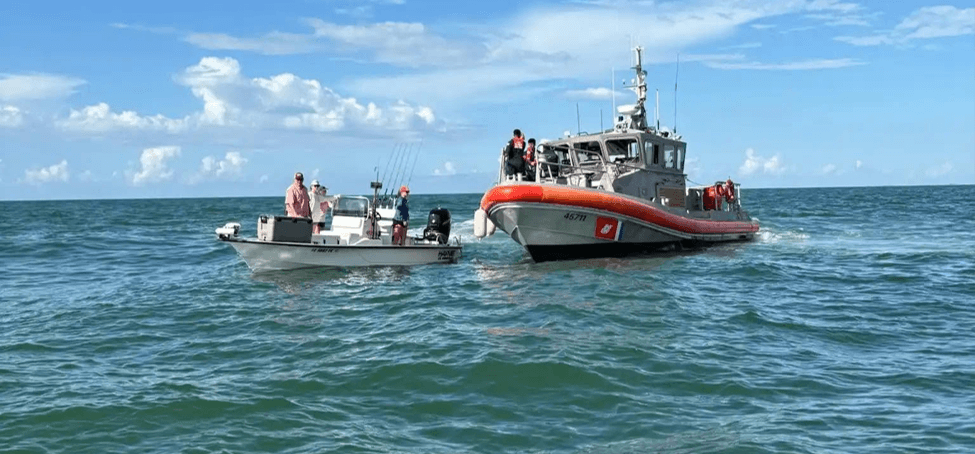 A person pulling folks out of the water