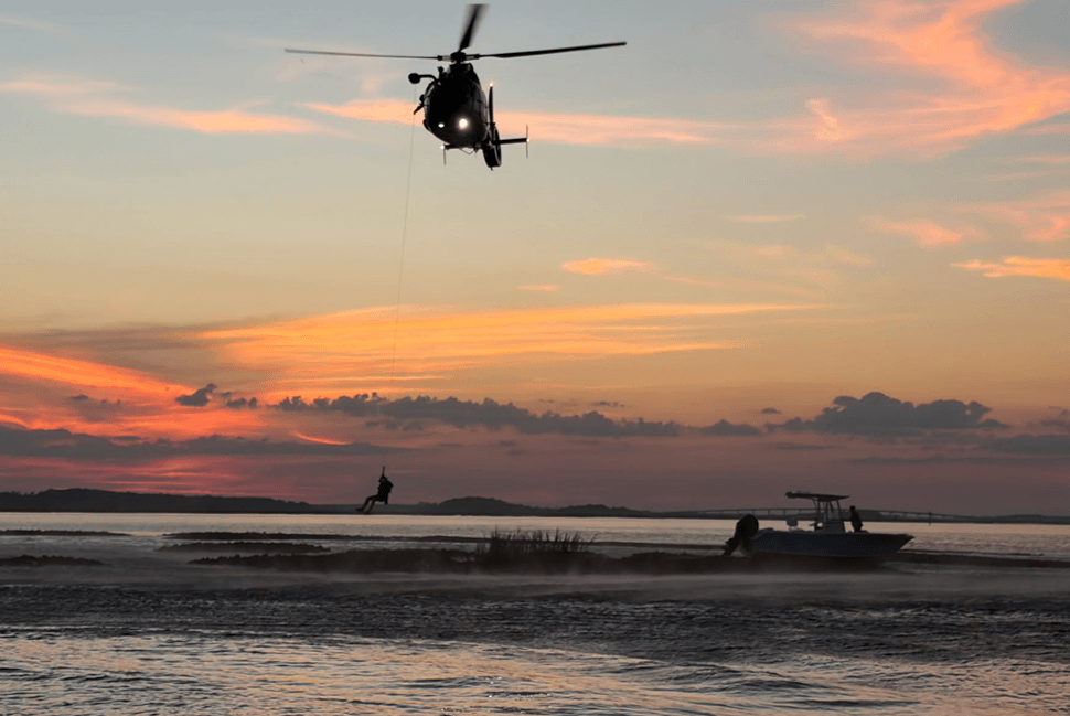 Helicopter rescuing a swimmer