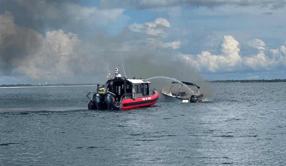 A boat on fire in an Inlet