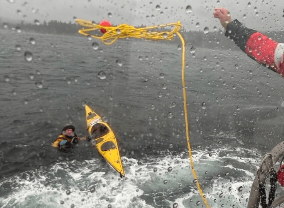 A man being rescued from the water