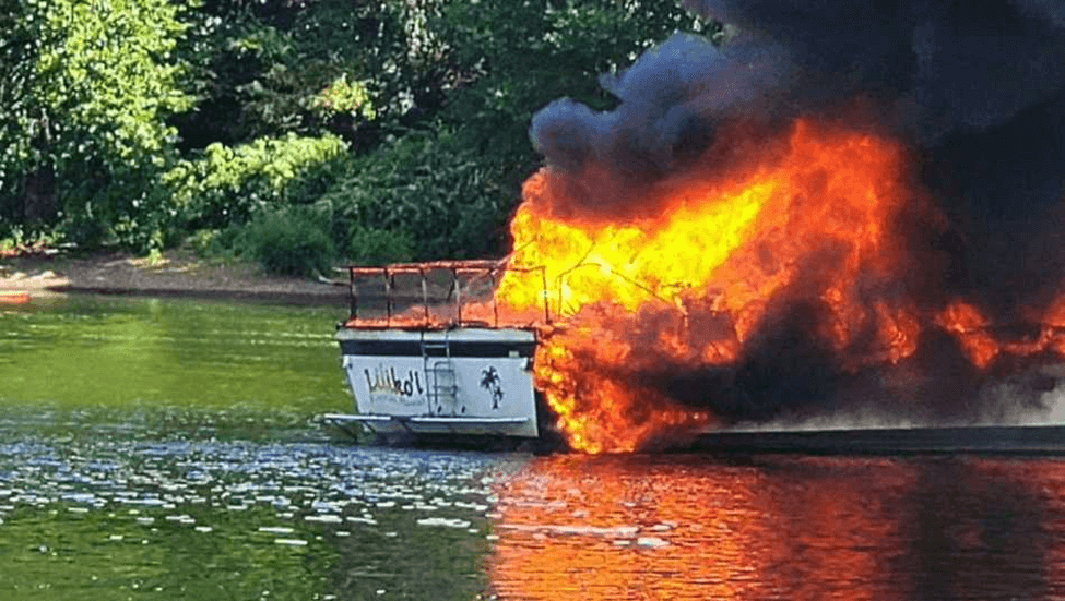 Boat in flames on a River