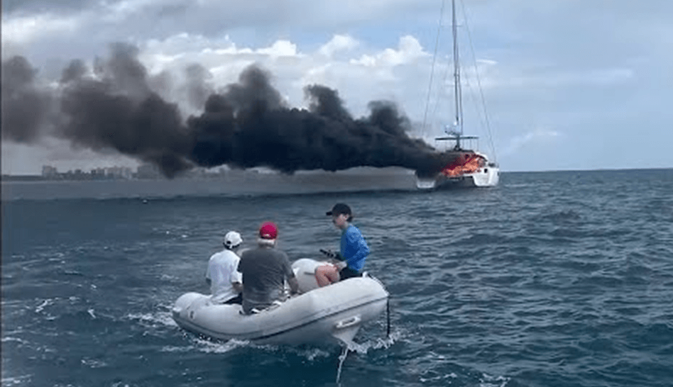 Men rescued from a Sailboat on fire.
