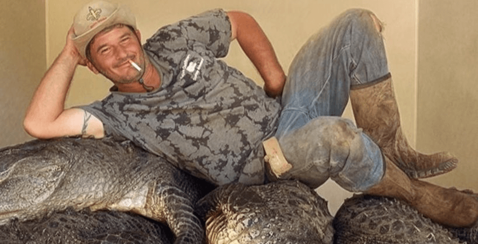 Man posing with a hat one.