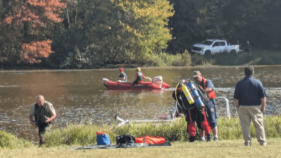Rescue men around a lake