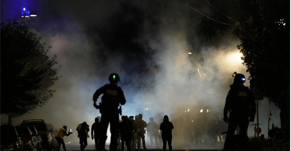 Fire crew putting out a fire at night