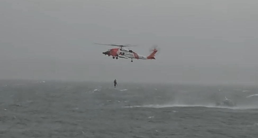 Helicopter saving a man from water