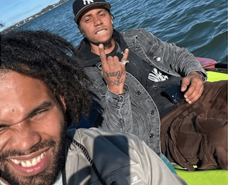 Two men on a raft in water