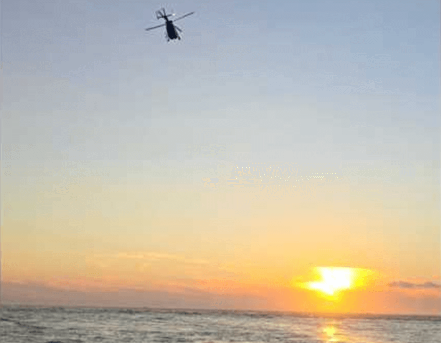 Helicopter over the water