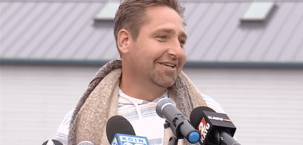 Man speaking into a microphone