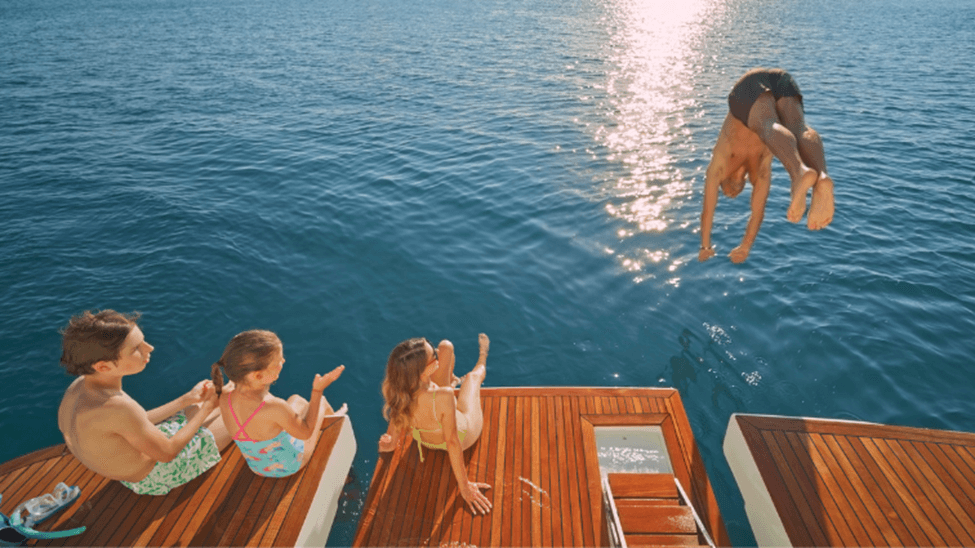 Man diving off yacht