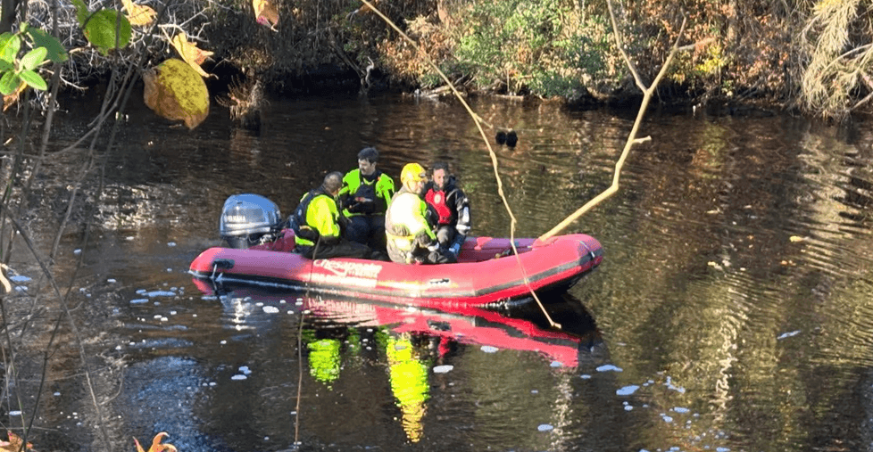 Crew on a raft in the lake.
