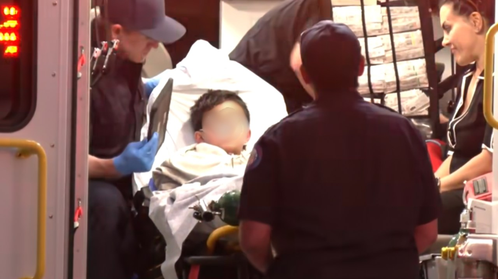 Boy being put in Ambulance