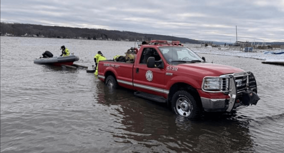 Truck pulling boat out of the water