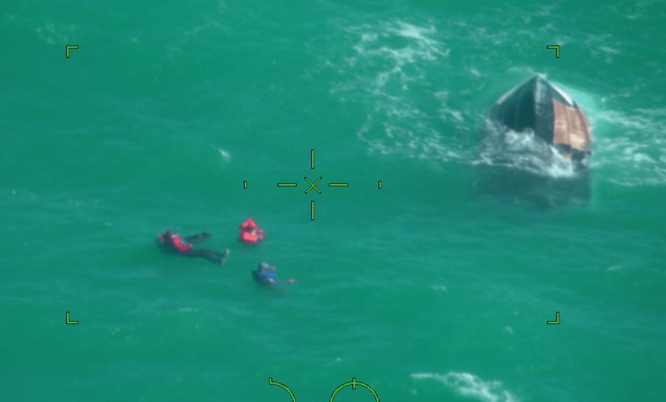 Boaters being rescued from water