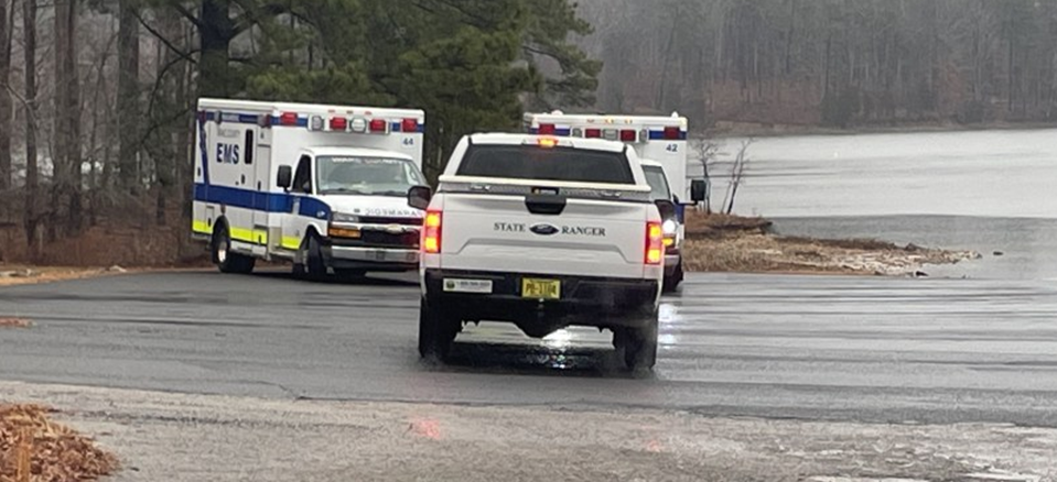 A Truck and 2 EMS Trucks on Road