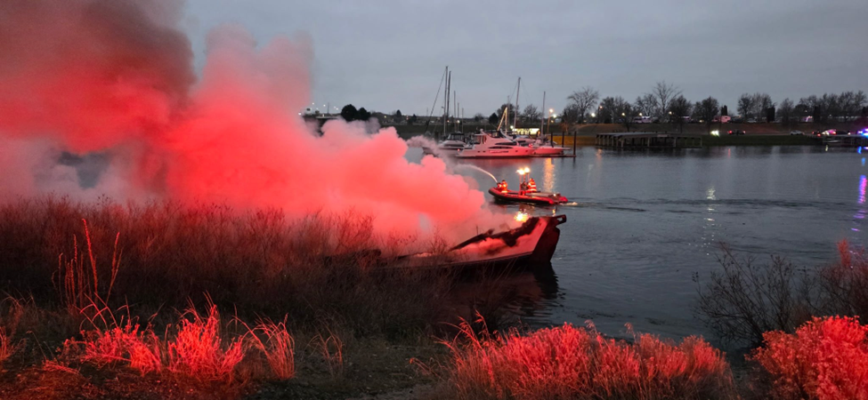 Boat on fire in the river