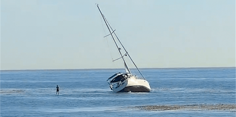 Sailboat stuck in low tide