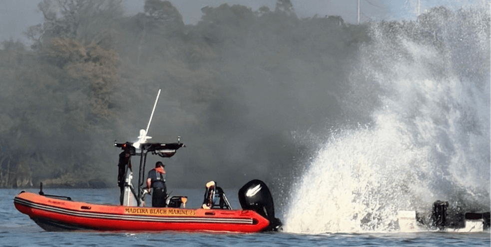 Marine Boat using motor to put out fire