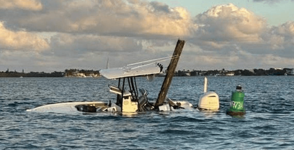 Half sunken boat in the ocean.